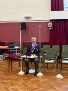 royal arch DC sat in chair