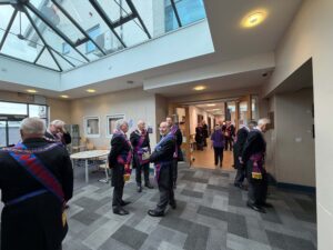 senior royal arch masons mixing before a meeting