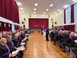 royal arch companions sat in a hall being briefed by the provincial GDC